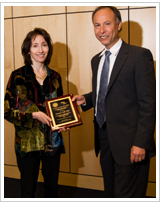 Elissa Epel accepts the award from Mitchell D. Feldman on behalf of Dr. Adler